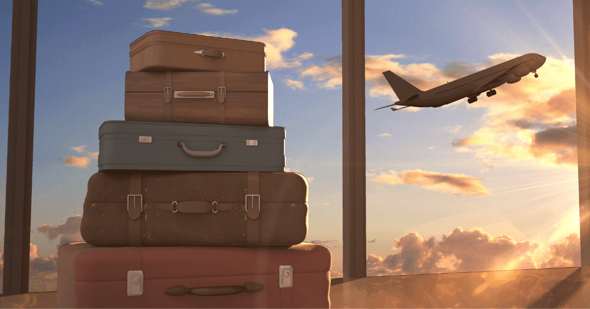 Emigration: A stack of suitcases against a window revealing a sunset and a plane