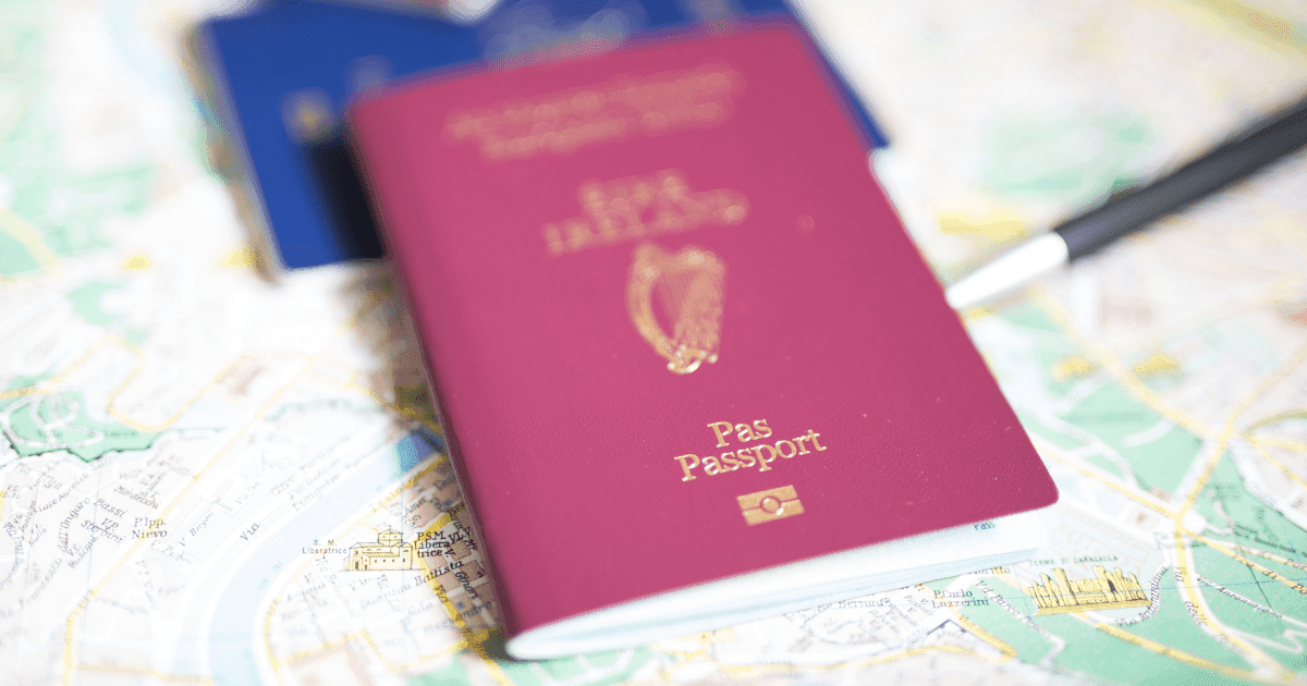 ADHD: An Irish passport lies on top of a blue European document. Both passports are ontop of a map where a pen is marking the route