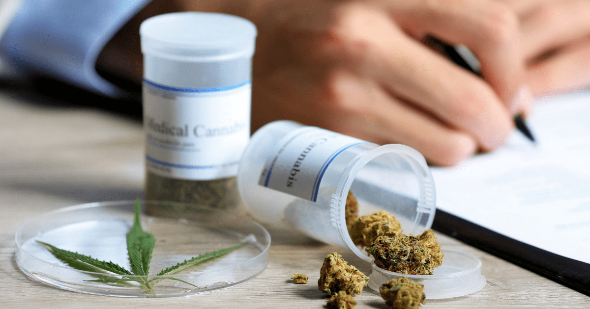 California: Two white tubs of medical cannabis on a wooden surface. A doctor is writing a prescription