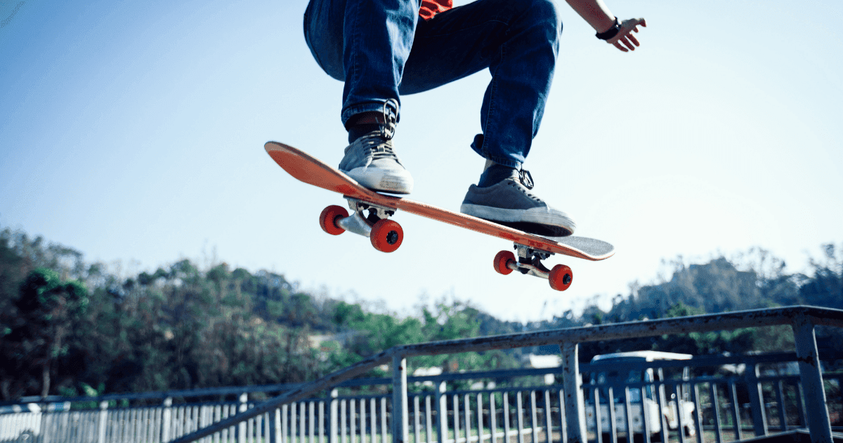 Pro - skateboarding: A man on a skateboard jumps into the air