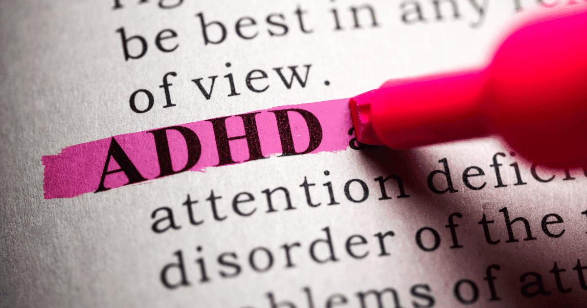 ADHD: A pink pen highlighting the word ADHD in a text