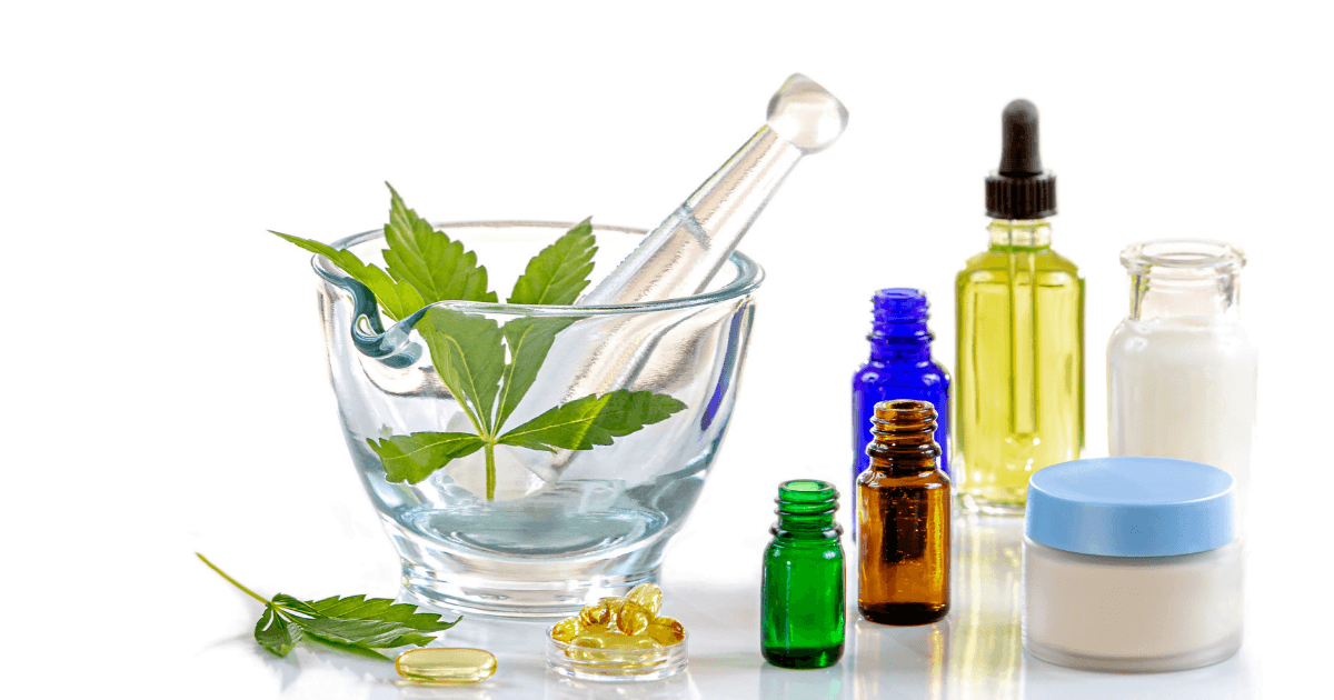 Cannabinoids: A range of different bottles, tubs and containers for CBD oil. A mortar and pestle has cannabis leaves in it