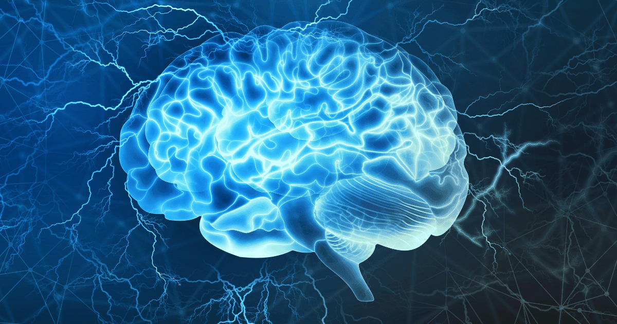 Dystonia: A blue brain lit up by a blue light to highlight parkinsons disease