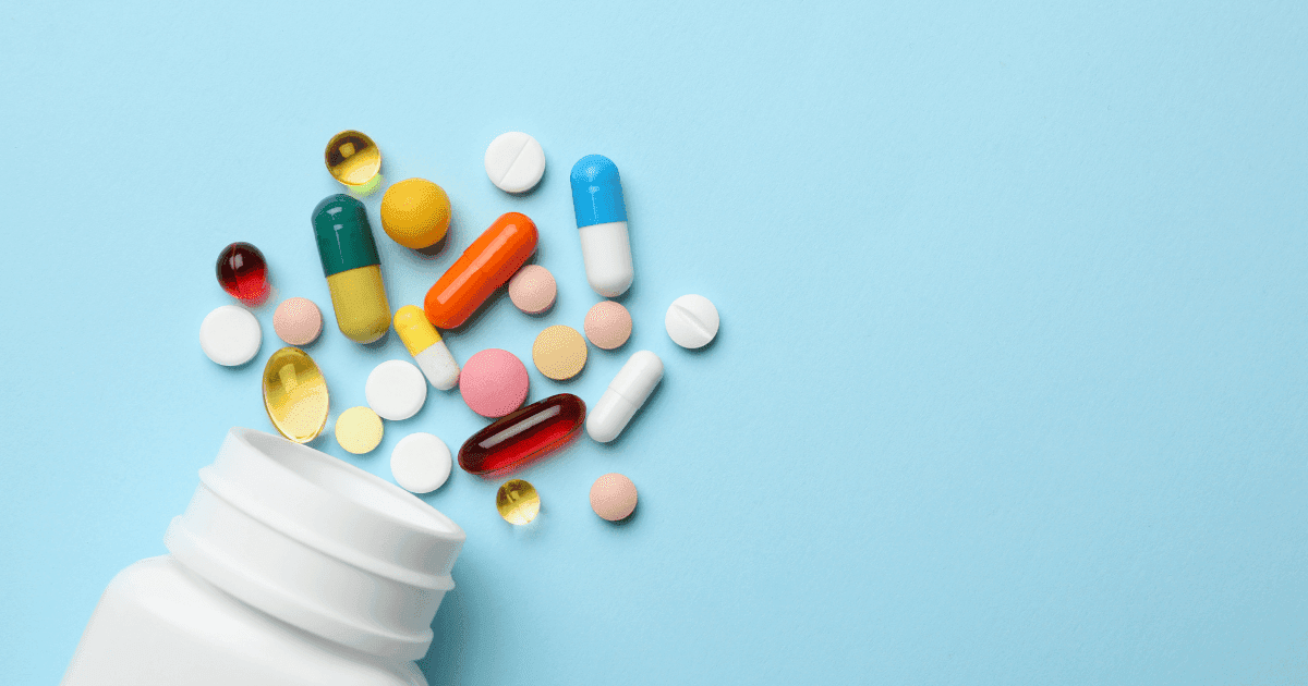 Florida: A white bottle of colourful pills spilling across a blue background