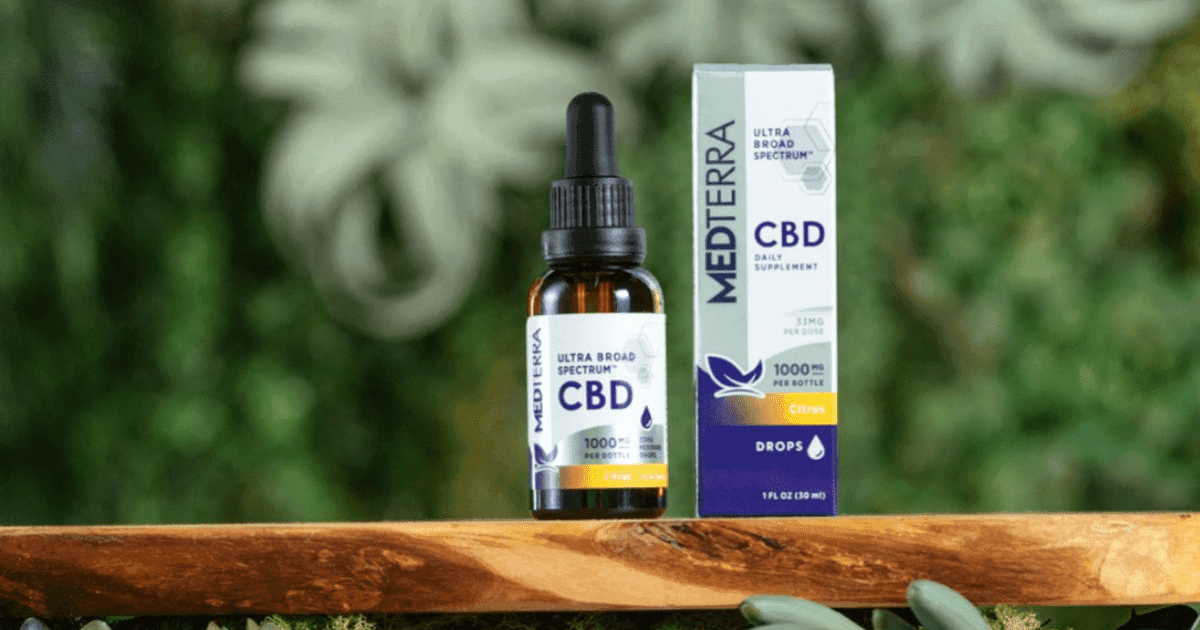 Medterra: A bottle of CBD next to its box on a wooden shelf