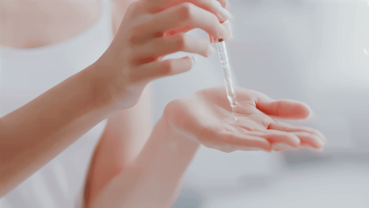 Anti-Ageing: A woman putting oil on her skin