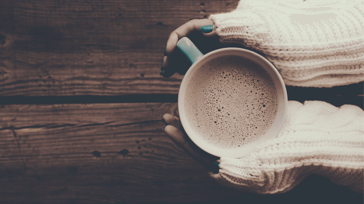 Raynaud's Disease: Hands gripping a hot cup of tea with CBD to ease blood flow and pain