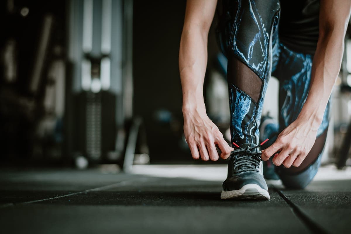 Runner tying shoelaces before exercise
