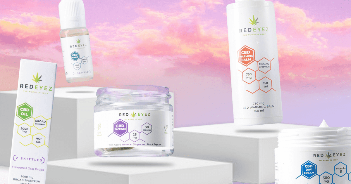 Red Eyez: A collection of CBD jars and bottles against a pink and orange sunset
