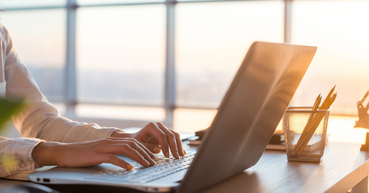 Medical cannabis, cancer and me: A woman typing on a keyboard writing a blog