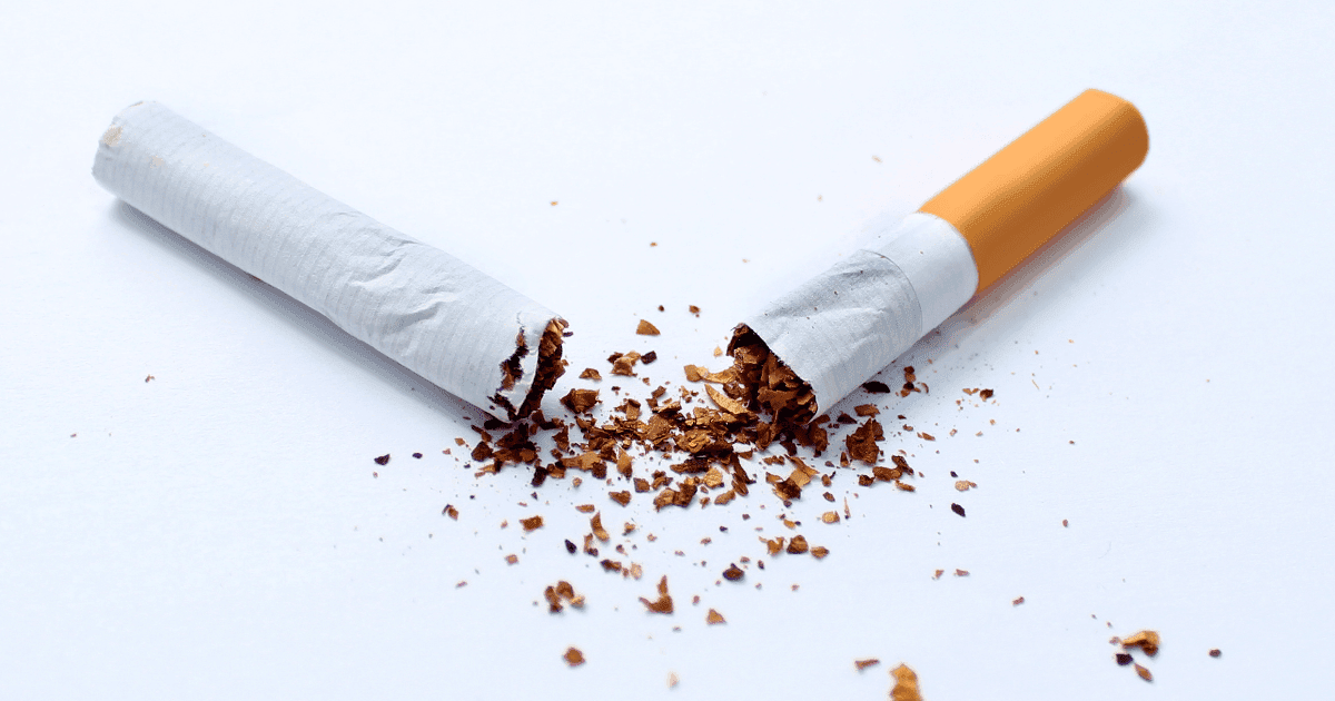 Smoking: A cigarette stubbed out on a white background