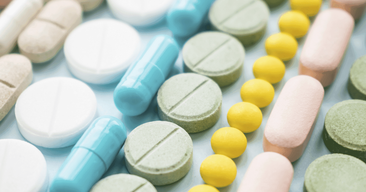 Opioids: A row of pastel coloured tablets