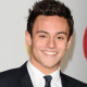 Olympian Tom Daley in a black and white suit