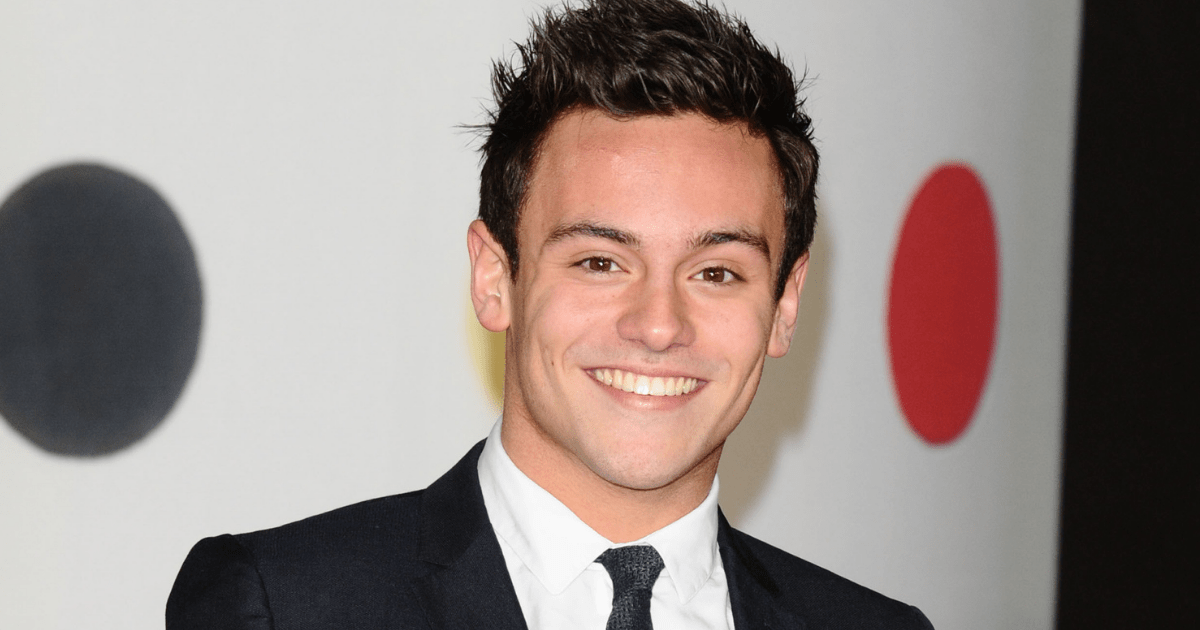 Olympian Tom Daley in a black and white suit