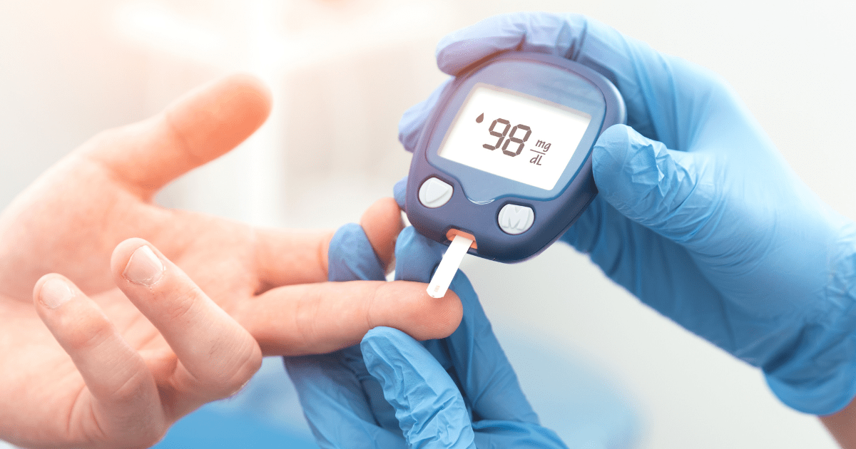 Diabetic neuropathy: a diabetic person testing their glucose levels on a blue blood sugar monitor