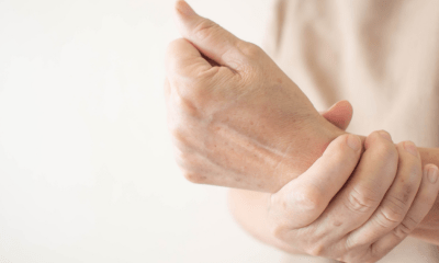 Arthritis: A hand holding a wrist in pain