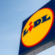 Lidl: A sign for German brand Lidl against a clear blue sky