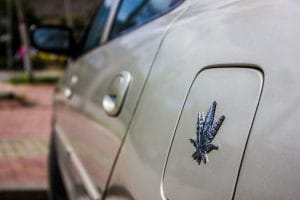 CLIMATE CHANGE: A silver car with a hemp leaf on its fuel lid