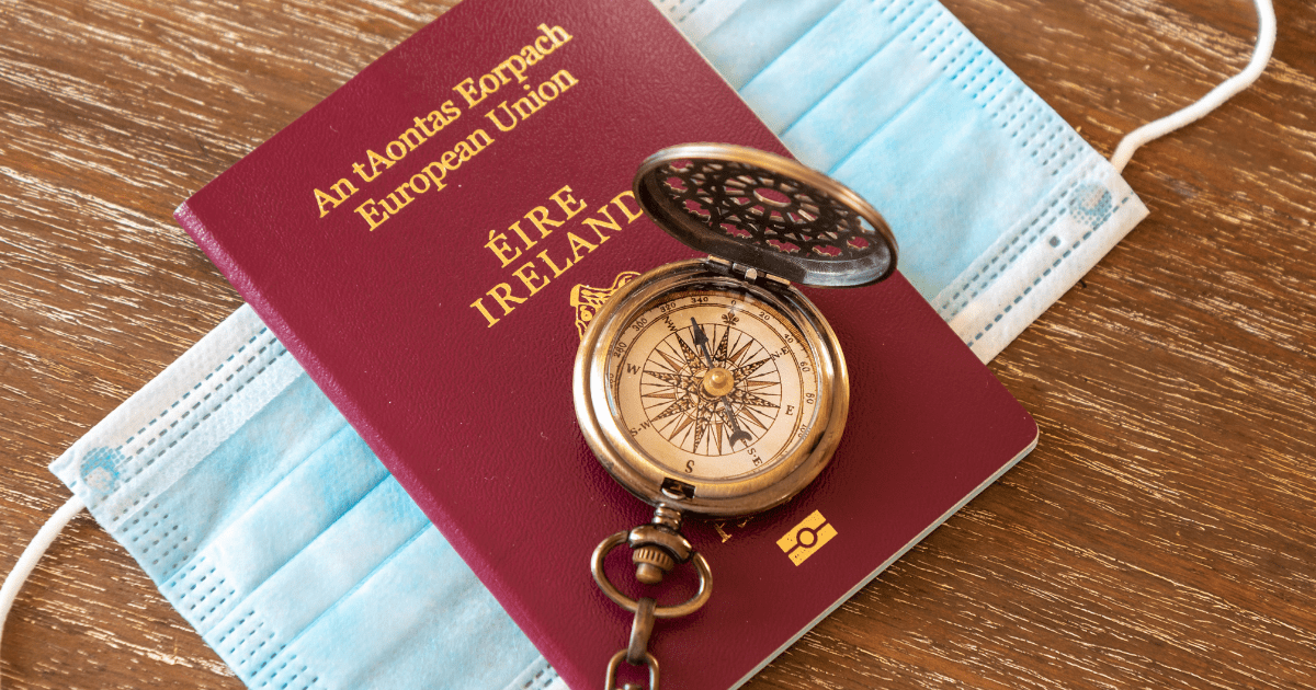 Access: A red Irish passport on top of a blue covid mask with a stop watch on top to highlight emigration