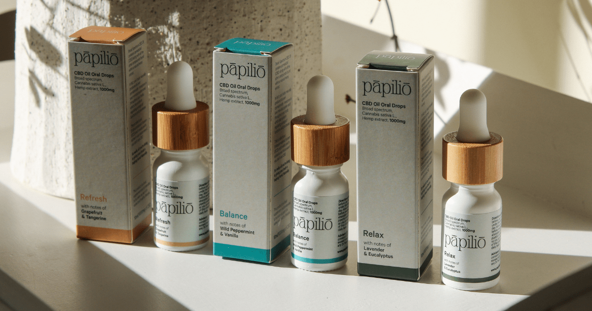 Papilo Products: A row of CBD bottles next to their boxes
