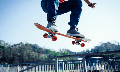 Pro - skateboarding: A man on a skateboard jumps into the air
