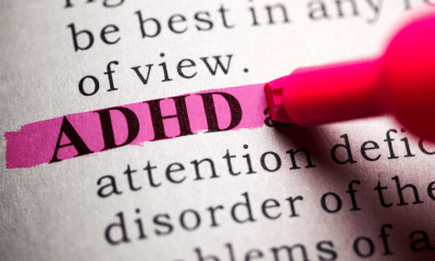 ADHD: A pink pen highlighting the word ADHD in a text