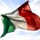 Italy: An Italian flag floating against the blue sky