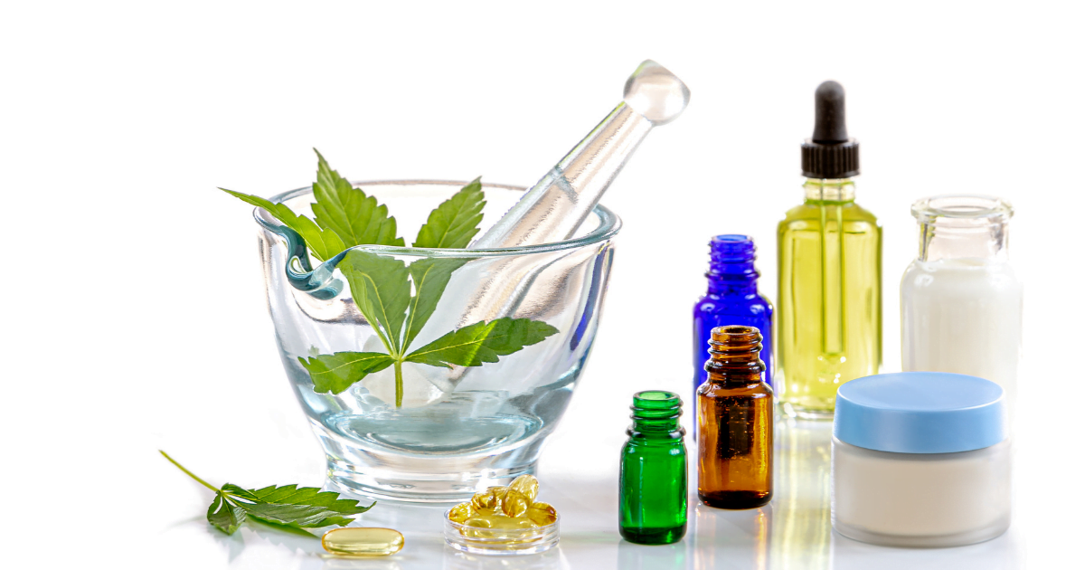 Cannabinoids: A range of different bottles, tubs and containers for CBD oil. A mortar and pestle has cannabis leaves in it