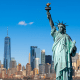 New York: The statue of Liberty against a blue sky and the skyline of New York city