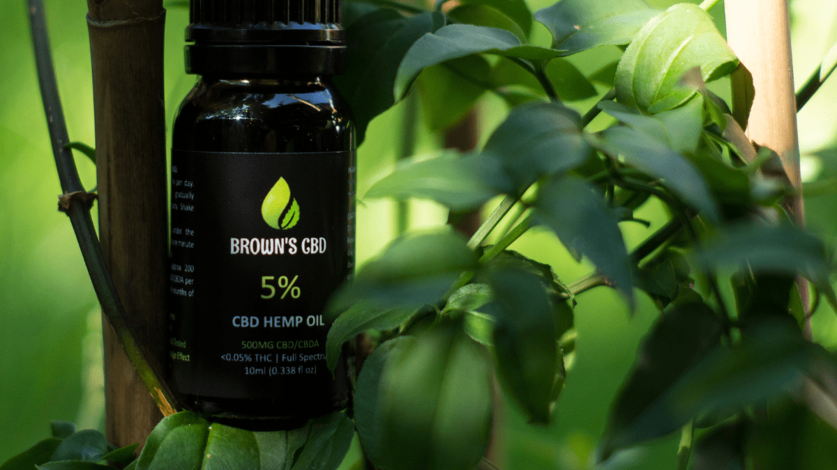 Browns CBD: A bottle of browns CBD oil and a green plant