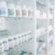 Dispensary Green: Blurred image of pharmacy shelves