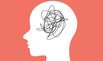 Mental health: An orange illustration of a white head with black jumbled up thoughts represented by a line