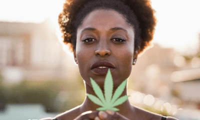 Africa: A woman holding a cannabis leaf