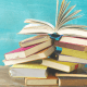 A to Z: A pile of books on a blue background