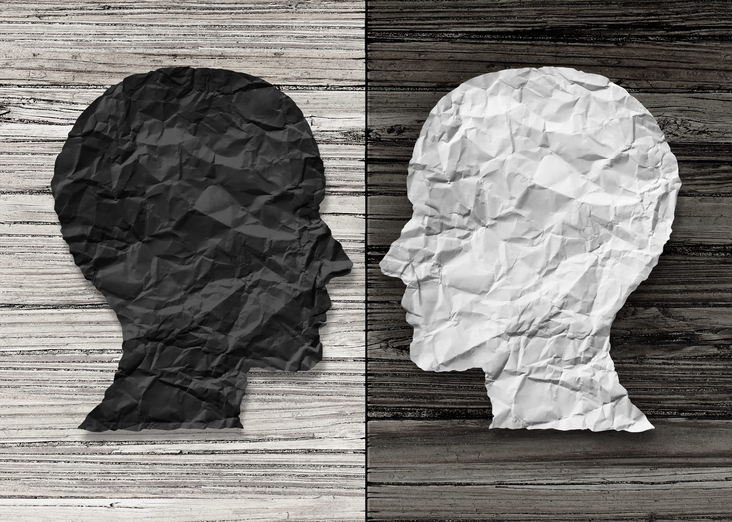 Bipolar Disorder: two faces in black, grey and white to highlight mental health
