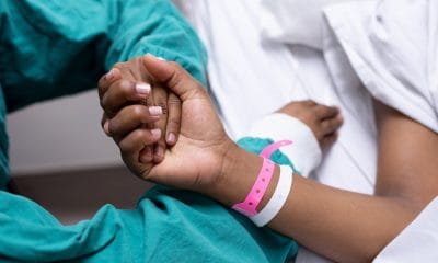 Cancer: Doctor holding patients hand