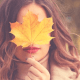 Skincare: A woman holding a leaf over her face