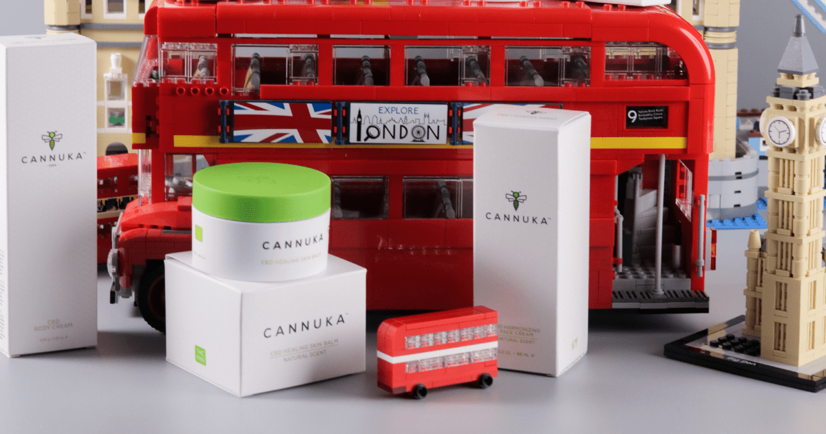 Cannuka: A selection of products in front of a red London bus