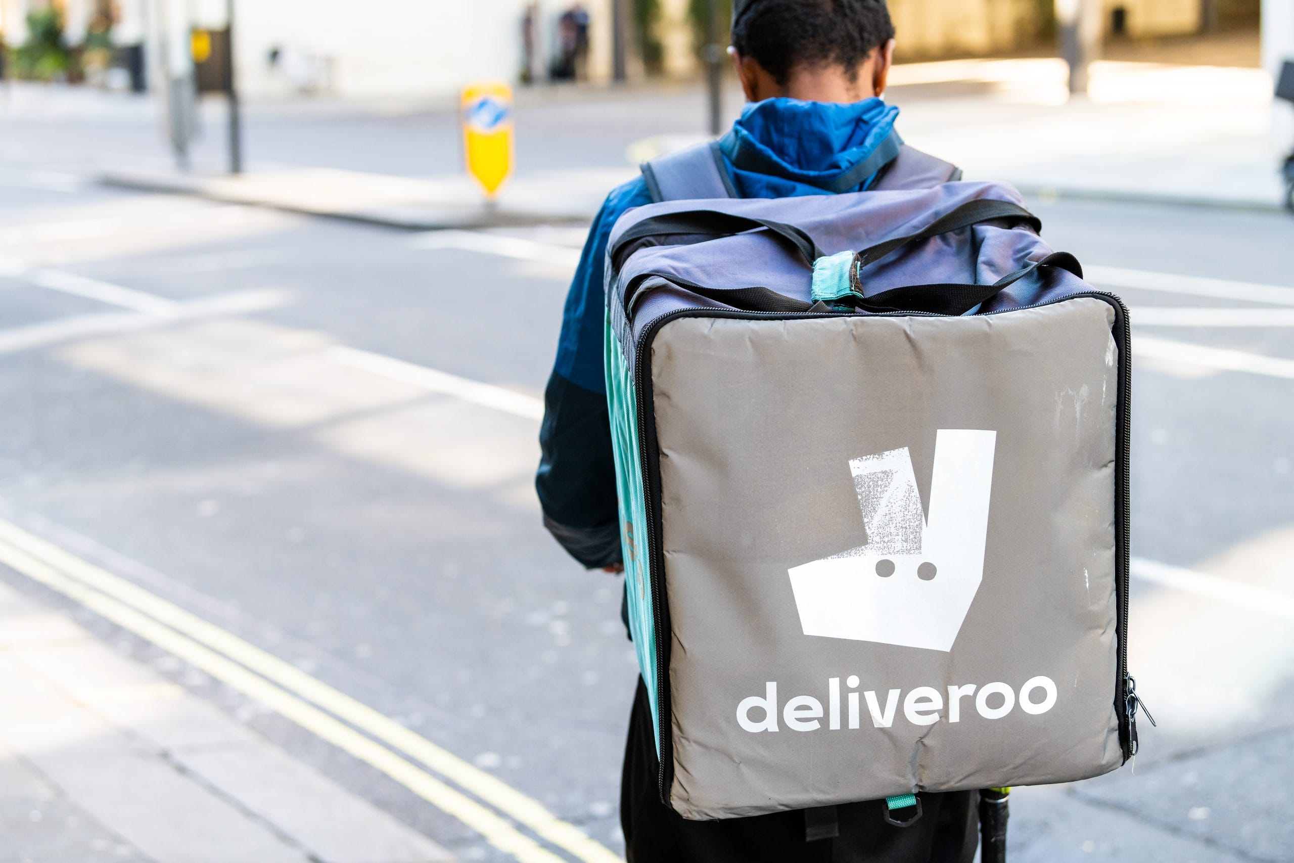 Deliveroo: A man with a deliveroo bag on his bag