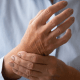 Arthritis pain: A woman holding her hands