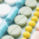 Opioids: A row of pastel coloured tablets
