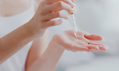Anti-Ageing: A woman putting oil on her skin