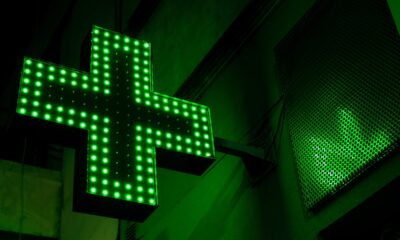 Cannabis pharmacy icon lit up in neon green